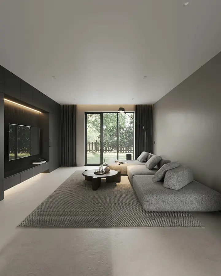 A calm, modern rented living room with a grey sofa