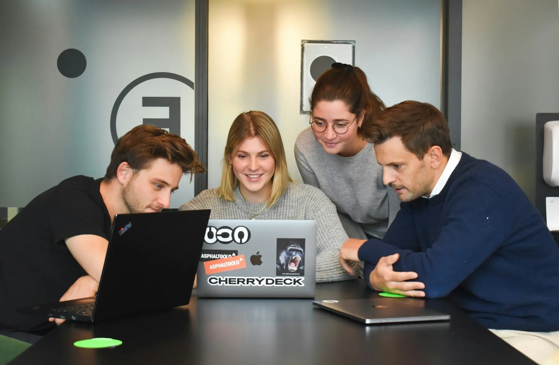 The Lumen team talking through a project around a meeting table