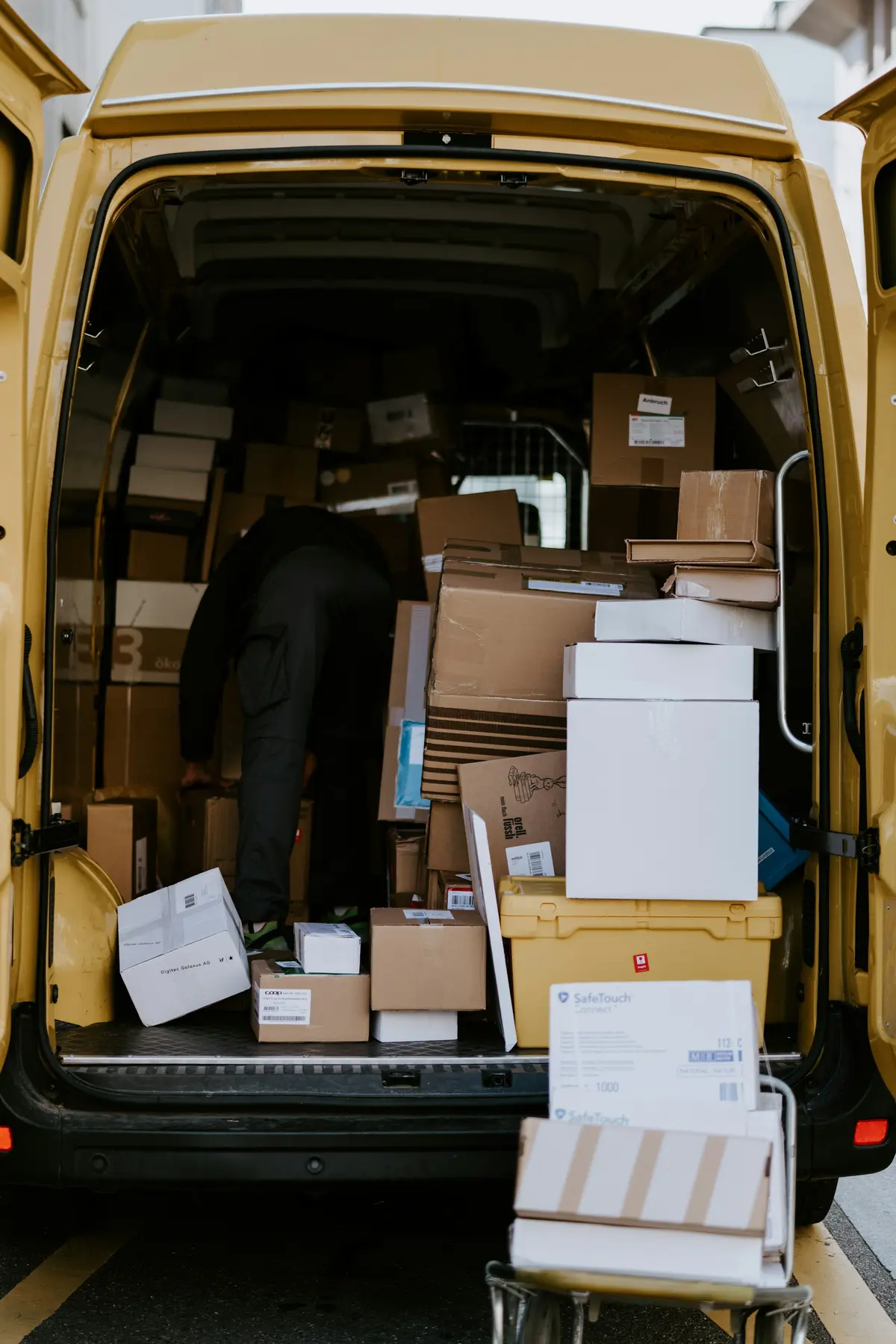 The open back of a removal van, packed with boxes